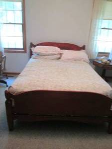lot 200 image: Vintage hardwood Full Size bed fram...