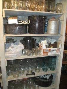 lot 104 image: Shelf filled with canning jars, sto...