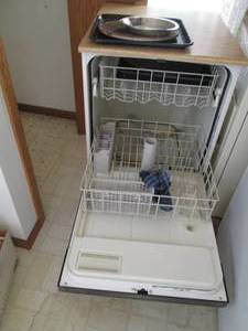 lot 33 image: Black portable Kenmore dishwasher, ...