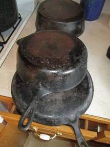lot 51 image: Cast Iron stock pots and skillet...