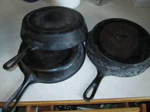 lot 52 image: Trio of cast iron skillets...
