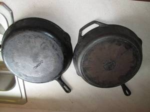 lot 54 image: Pair of deep cast iron skillets...