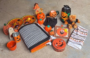 lot 399 image: Spooky Halloween Decor including Placemats, Dish Towel, Plates, Pumpkins and More