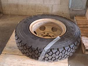 lot 24 image: 6-Lug Rim with 10.00R20 Tire