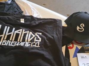 lot 254 image: Swan Knit Cap and 4 Hands Brewing T-Shirt X-Large (black)