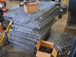 lot 32 image: Lot of (6) Wire Shelving Units - shelves, posts, casters, accessories - Unassembled