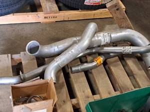 lot 185 image: (4) Assorted Exhaust Pipe Sections and (2) Exhaust Hangers