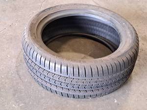 lot 23 image: Lot of (1) Goodyear Eagle Sport 24545R18 100V Tire