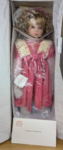 lot 50 image: New Rebecca Porcelain Doll World Gallery Collection by Norma 2711000 with Certificate of Authentication