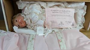 lot 60 image: New Bed of Roses Awake Porcelain Doll First Born Collection by Lee Middleton 8712000 with Certification of Authentication