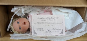 lot 63 image: New Baby Sister Porcelain Doll Little Love Collection by Lee Middleton 7872000 with Certificate of Authentication