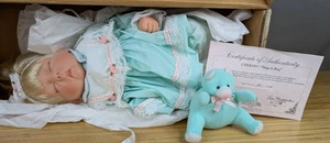 lot 64 image: New Cherish Porcelain Doll Hug A Bug Collection by Lee Middleton 18215000 with Certificate of Authentication