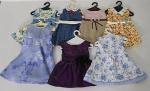 lot 61 image: Doll Dress Selection, Including Authentic American Girl Styles