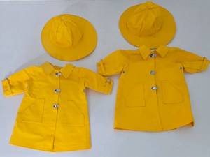 lot 69 image: Two American Girl Doll Molly Rain Slickers with Hats  Pair of American Girl Doll Molly Rain Coats