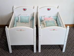 lot 27 image: Pair of American Girl Bitty Baby Cribs