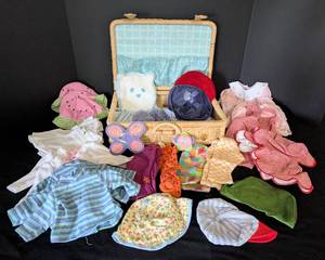 lot 28 image: American Girl Bitty Baby Doll Clothing and Wicker Storage Box