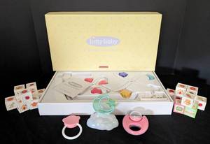 lot 55 image: American Girl Bitty Baby Spinning Mobile and Doll Toys
