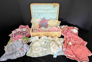 lot 56 image: American Girl Bitty Baby Doll Clothing and Wicker Storage Box