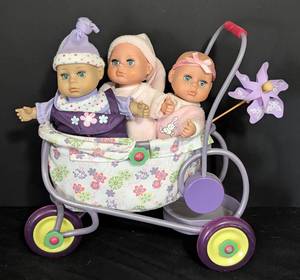 lot 110 image: Three Battat Baby Dolls and Stroller