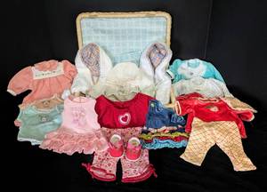 lot 128 image: American Girl Bitty Baby Doll Clothing and Wicker Storage Box