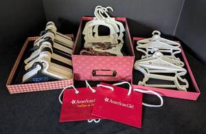 lot 195 image: Assorted American Girl Clothing Hangers