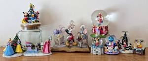 lot 249 image: Assorted Disney Figurines and Globes including Disney Snow White, Cinderella, and Sleeping Beauty Christmas Tree