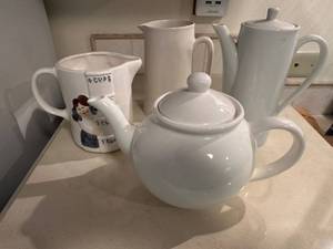 lot 132 image: Collection of 4 Ceramic Pitchers and Teapots Featuring Vintage Designs