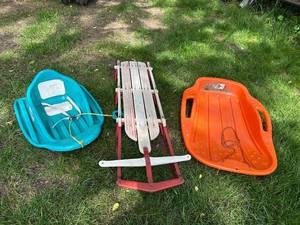 lot 42 image: Lot of 3 Sleds Flexible Flyer F021 and Two Plastic Toboggans