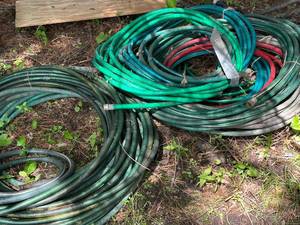 lot 43 image: Collection of Garden Hoses in Various Lengths and Colors