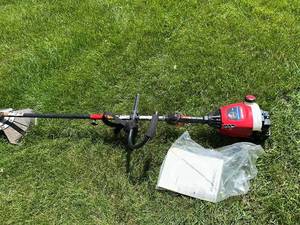 lot 85 image: Troy-Bilt 2-Cycle Gas String Trimmer with Manual