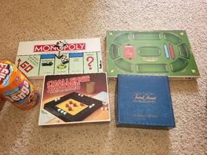 lot 100 image: Collection of 5 Board Games - Monopoly, Tripoley, Challenge Yahtzee, Jenga, and Isaac Britell Set