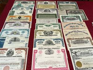 lot 128 image: Collection of Vintage Stock Certificates from Various Companies