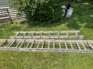 lot 167 image: Two Extension Ladders including a 12 Ladder and a 24 Werner Aluminum Extension Ladder