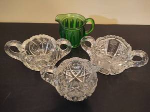 lot 105 image: Heisey Green Glass Creamer & Asst Crystal CreamerSugar Bowls