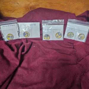 lot 38 image: 6 Legends of the West 50c Coins and 4 WW I Coins