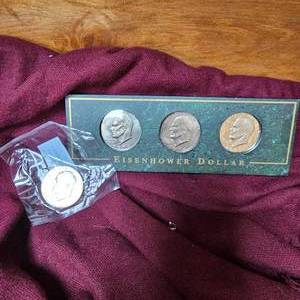 lot 61 image: 4-Eisenhower Dollars, (1 is a proof, 1UNC60 grade)