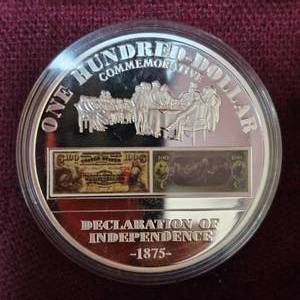 lot 64 image: History of Early $100 Collectors Coin, Silver Plated