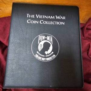 lot 1 image: 2-Binders Vietnam War 50c-Color Gilded Coins