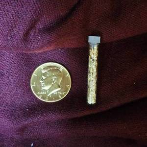 lot 88 image: 2015 Gold Plated Kennedy and 24kt 3mil tube of Gold flakesPieces