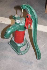 lot 179 image: Vintage Hand Water Pump with Red and Green Finish