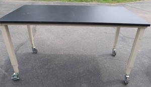 lot 45 image: SLATE TOPPED ROLLING TABLE.