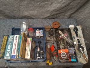 lot 27 image: Collection of Automotive Repair Manuals and Parts