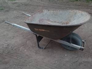 lot 47 image: Used Rusted Metal Wheelbarrow with Pneumatic Tire