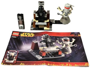 lot 054 image: LEGO Star Wars TIE Fighter Pilot Minifigure  Han Solo Carbonite Brick