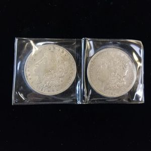 lot 22 image: 2  MORGAN DOLLARS  - VERY COLLECTIBLE  BOTH DATED 1921
