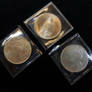lot 35 image: COLLECTIOIN OF PEACE DOLLARS IN VERY NICE SHAPE  3 TOTAL  ALL OF THEM WERE STRUCK IN 1923