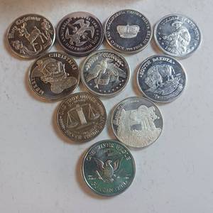 lot 39 image: 10 TOTAL ONE OUNCE BULLION PYRAMID IN A CASE - .999 SILVER, TAX EXEMPT  Silver Trade Units  International  Peace on Earth 2002  South Dakota  Golden State Mint  FDR 1982  1980 Liberty Lobby Silver Eagle  & More