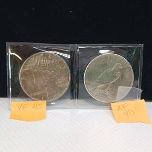 lot 63 image: TWO U.S. SILVER PEACE DOLLARS  1924 & 1935