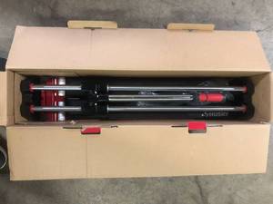 lot 25 image: Husky 24 in. Tile Cutter with Tungsten Carbide Blade and Adjustable Gauge  Customer Returns See Pictures