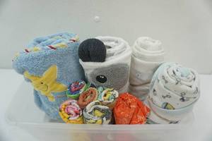 lot 28 image: Plastic Organizer with Kids Towels & Washcloths